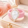 Elegante roze siliconen ring met een sprankelende druppelvormige zirkoon in doos - Maat 6 / Roze