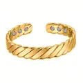 Close-up detail of a gold twisted magnetic cuff bracelet with inner healing magnets - Gold