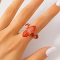 Elegant handmade beaded ring featuring a vibrant red hexagonal crystal stone point - Red Agate