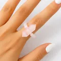 Hand wearing a pink rose quartz hexagonal prism beaded ring against a white background - Rose Quartz