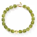 Olive green acrylic beaded necklace featuring a polished central gold sphere accent - Light Green