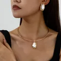 Elegant gold choker necklace and earrings set with baroque style faux pearl pendants - Choker + Earrings Set / White