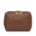 Close-up of brown woven texture cosmetic bag with gold-tone double zippers - Brown