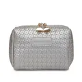 Silver woven pattern makeup bag with gold zippers and rectangular patch. - Silver