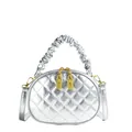 Detailed view of a silver quilted handbag with a metallic finish and ruffled handle - Silver