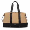 Detailed front view of a khaki and black large capacity travel duffel bag for women. - M / Khaki