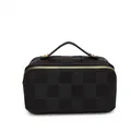 Detailed view of the black woven checkered pattern and gold hardware on handbag - Black