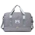 Grey quilted travel duffel bag featuring a separate bottom shoe compartment and strap. - Dawn Grey