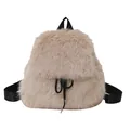 Close-up of beige fuzzy faux fur backpack featuring black drawstring and nylon shoulder straps. - Khaki