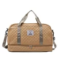 Detailed view of khaki quilted travel bag with double handles and shoulder strap - Khaki