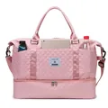 Pink quilted travel bag with independent shoe compartment and multiple storage pockets - Pink