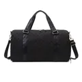 Black quilted duffle bag with gold hardware for gym or short travel business trips. - Black