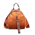 Close-up detail of a vibrant orange shell-shaped backpack featuring patterned straps. - Orange