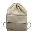 Detail showing the front pocket and drawstring closure of this beige nylon bucket backpack. - Light Khaki