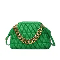 Detail shot of a green quilted handbag with a chunky gold-tone chain strap and frame closure - Green