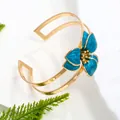 Elegant gold-plated open cuff bracelet with a large blue enamel flower for women in resort style - Bangle / Blue