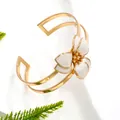 Elegant gold-plated open cuff bracelet featuring a delicate white enamel flower design - Bangle / White
