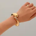 Elegante bracciale rigido geometrico irregolare dorato con accenti di strass brillanti - Stile Geometrico Irregolare Pavé di Strass (款式十五) / Oro