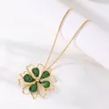 Gold-toned necklace with green enamel flower pendant in forest resort style - Necklace / Green
