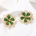Elegant green enamel flower stud earrings with gold hollow frame for women. - Earrings / Green