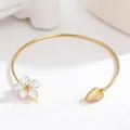 Elegant minimalist gold-toned open bangle featuring white enamel flower and leaf detail - Choker (BSHB-TZ) / White