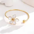 Elegant gold flower bangle bracelet featuring white enamel petals for women's fashion jewelry - Bangle (BSHB-TZ) / White
