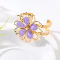 Elegant gold-tone open cuff bracelet decorated with a vibrant purple enamel flower - Bangle / Purple