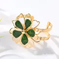 Elegant gold open cuff bracelet featuring a large green enamel flower design for women - Bangle / Green