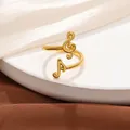 Detail of gold-plated adjustable music note ring with G-clef and musical motif for lovers. - Open Adjustable / Gold