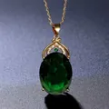 Exquisite close-up of a luxury oval green gemstone pendant with gold chain necklace - Green
