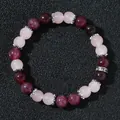 Elegant pink and red crystal bead bracelet with silver spacers on black textured background - Rose Quartz & Red Strawberry Quartz Style (Model 2026316 Style 17)