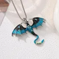 Detail shot of a vintage dragon pendant featuring blue enamel and rhinestone inlay - Dragon Necklace / Blue
