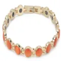 Elegante bracciale a maglie placcato oro con pietre tonde arancioni occhio di gatto. - Arancione