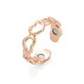 Macro detail of rose gold heart ring featuring hollow patterns and therapeutic magnets - Rose Gold