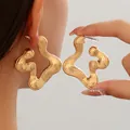 Retro golden statement earrings with unique wavy striped texture and organic shape - Style 6 Gold