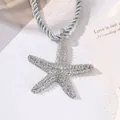 Detailed view of oversized silver starfish pendant on a thick light blue cord - Chain Only / Silver