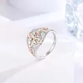 Detailed close-up of elegant two-tone Celtic knot ring with sparkling zircon stones - Size 7 / Two Colors