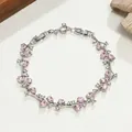 Elegantes Armband im Zweig-Stil mit ovalen rosa Kristallen und klaren Strasssteinen - Verschlungener Ast (HZSL) / Rosa