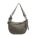 Stylish khaki crescent crossbody bag with adjustable strap and unique woven zipper pull - Green