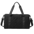 Detailed view of the quilted black travel duffel bag with shoulder strap - Black