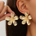 Detailed view of oversized vintage gold five-petal flower earrings with textured metal finish - Style 1 (HDTZ-658) / Style 1 Gold