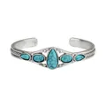 Front view of a bohemian vintage turquoise open cuff bracelet with silver engravings. - Teardrop Style