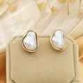 Detail view of elegant irregular baroque pearl stud earrings with gold metal frame - Earring Stud 2