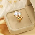 Close-up detail of an elegant gold-plated ring featuring a unique irregular pearl - Heart Shaped Irregular Pearl Ring