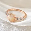 Elegant rose gold crescent moon ring featuring a large oval iridescent white faux opal stone - Size 6 / Rose Gold/White Zirconia