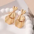 Elegant gold statement drop earrings with textured shell-like petal design and ridges. - Style 12 Gold
