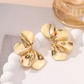 Detail of oversized golden petal earrings with a polished vintage finish - Style 13 Gold