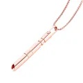 Detailed macro view of rose gold mindfulness breathing whistle pendant with rotating bead - Rose Gold