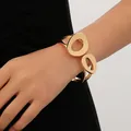 Elegante bracciale rigido minimalista in metallo dorato con motivi irregolari da donna - Stile a Onde Traforate Irregolari Minimalista (款式七) / Oro