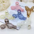 Detailed view of assorted colorful bow-shaped hair claw clips in elegant pastel tones - 13CM Large Bowknot Transparent Style / 6 Pieces/Pack / Colorful